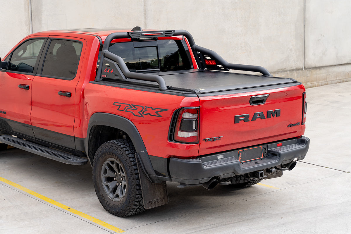 Bossco 4x4 Accessories Roller Cover installed on a red Ram pick up truck