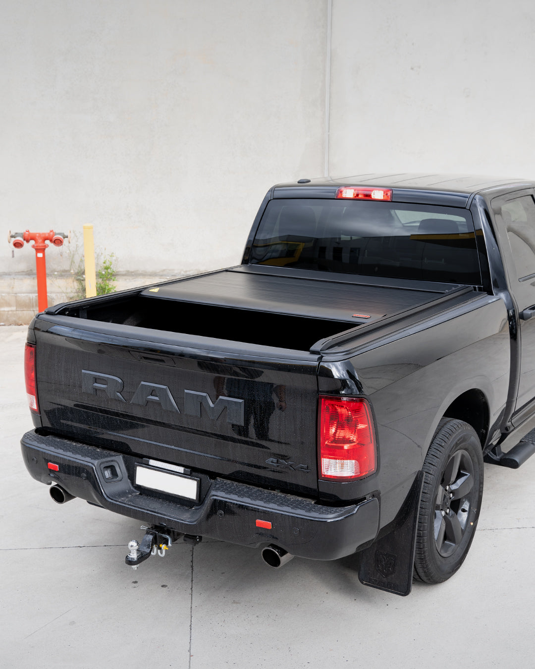 Electric Ute Cover installed on a black RAM pickup truck by Bossco 4x4 Accessories