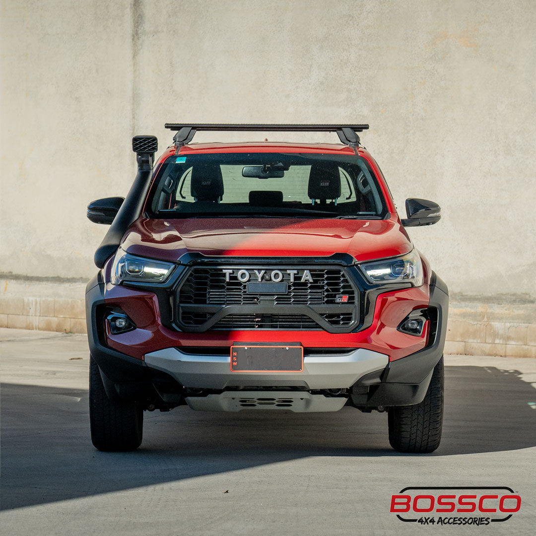 Bossco 4x4 Accessories car snorkel and roof rack installed on a red Toyota Hilux parked at Bossco 4x4 car park.