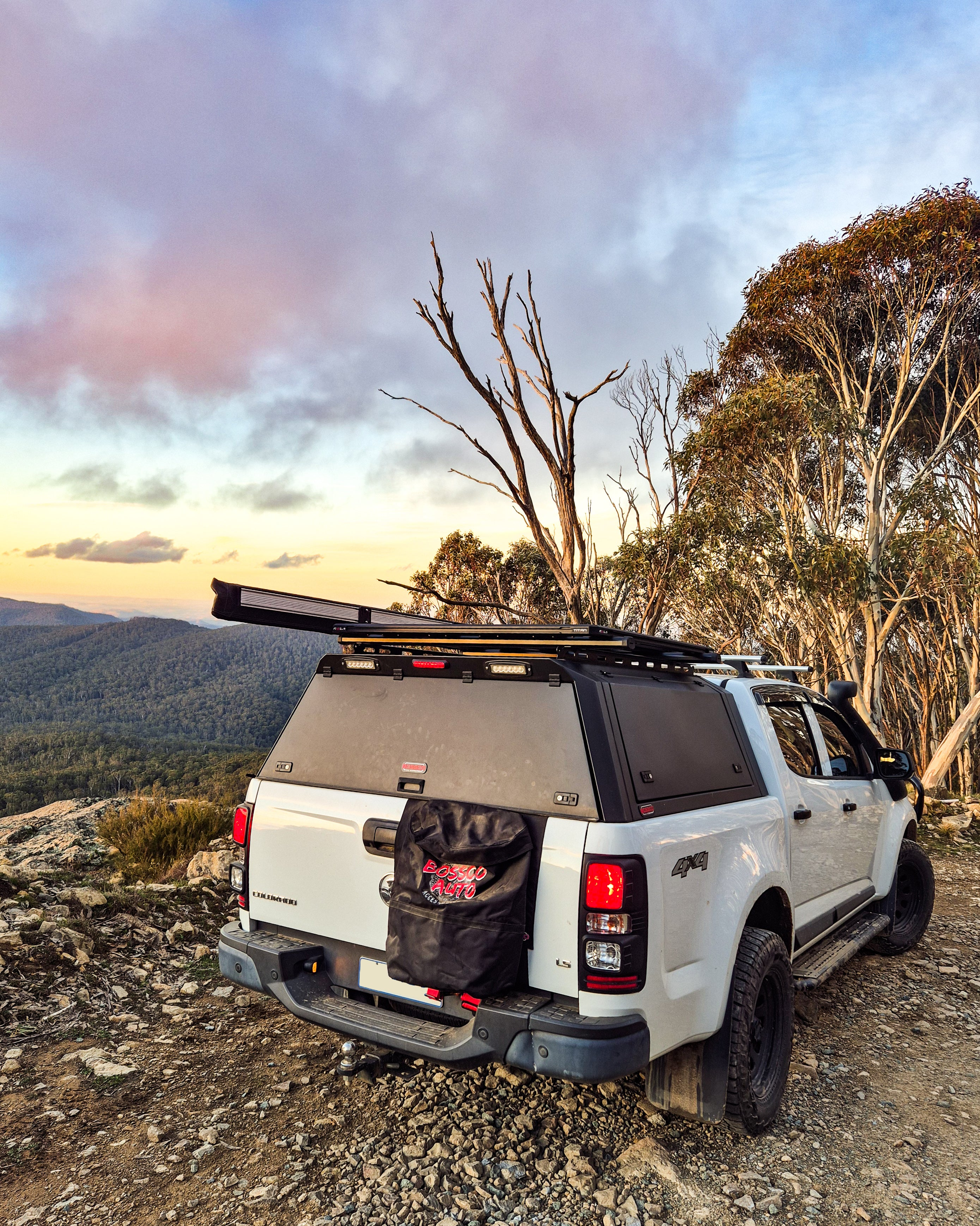 Bossco 4x4 ute Canopy, awning and roof racks installed on top of white holden colorado.  Pick up truck also shows 270 awning and Bossco aluminium canopy