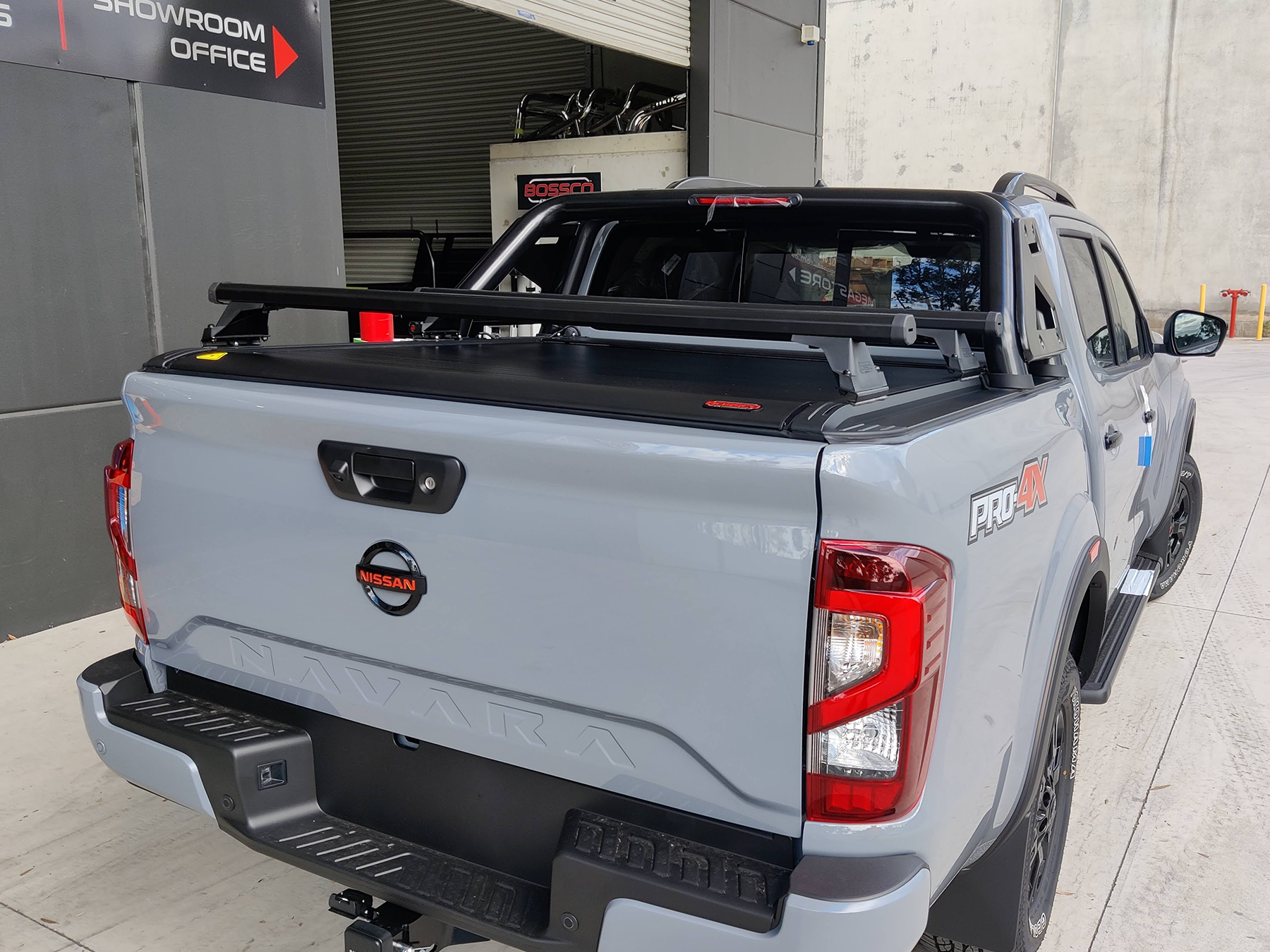 rear cargo roller rack installed on Nissan Navar with electric ute cover and roller tonneau cover by Bossco 4x4 Accessories