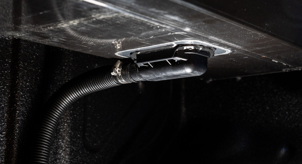 Drainage hose connection beneath a Bossco manual roller cover